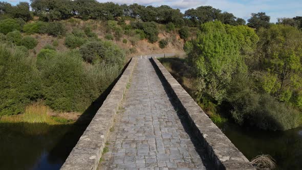 First-person view walking along Roman bridge at Vila Formosa In Portugal