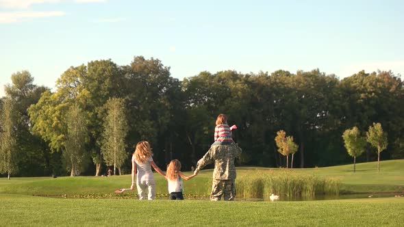 Family and Soldier in a Military Uniform Walking Away, Slow Motion