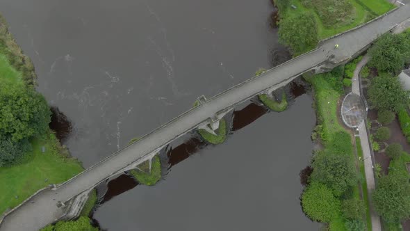 Slow motion, birds eye view of Stirling Old Bridge in Scotland while flying down.