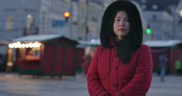 Portrait of Nervous Caucasian Woman Standing on City Street and Checking Time. Middle-aged Lady