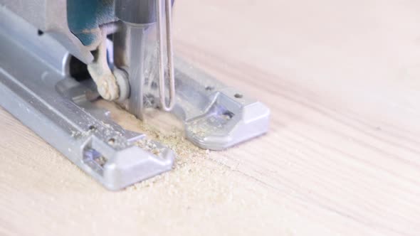 Working Fretsaw Closeup Carpenter Sawing Wood with the Electric Saw Fretsaw Saw with an Electric