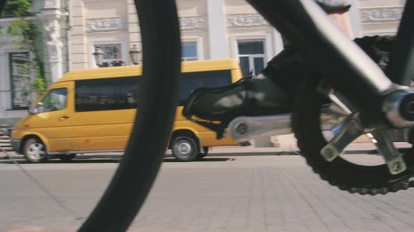 Cyclist Man Riding Fixed Gear Sport Bike in Sunny Day on a City