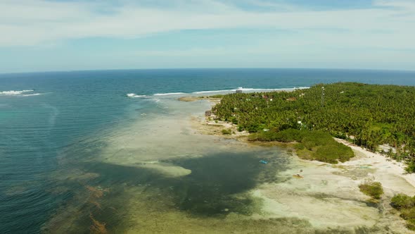 The Coast of Siargao Island, Blue Ocean and Waves