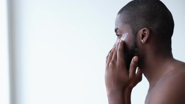 Male Skincare Applying Cream