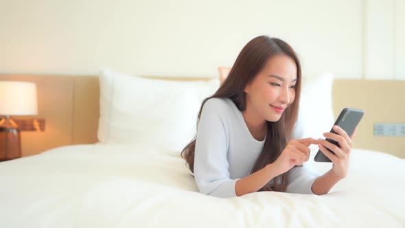 Young asian woman use smart phone