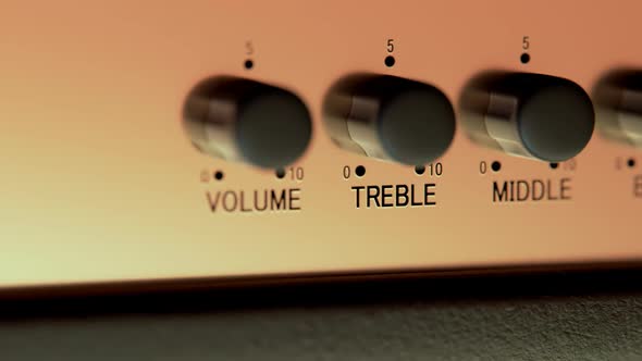 Close-up Of Amplifier Head Controller. Volume, treble, middle and Bass knobs