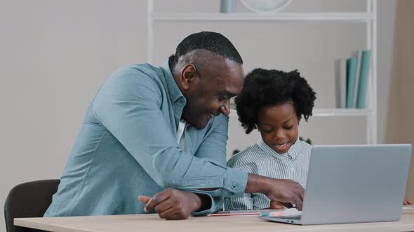 Adult Father Home Teacher Helping Little Daughter to Do Homework Sit at Desk in Room Study Remote