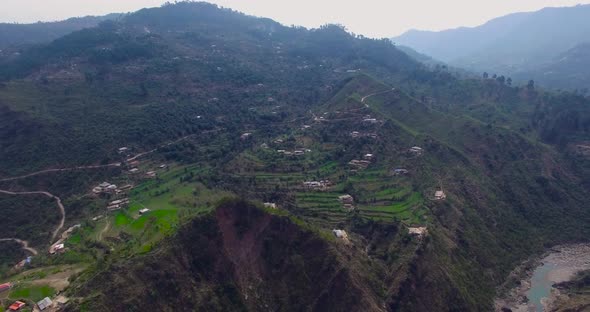 A drone view of a beautiful valley of mountains with river.