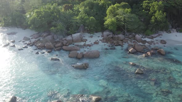 Aerial view of a person walking on the beach of Anse Lazio, Seychelles.