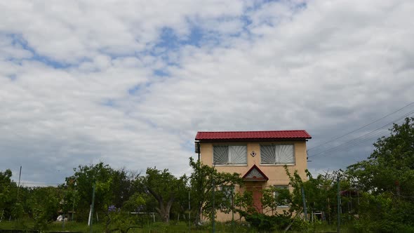 Time Lapse Farmhouse Rural Landscape with Clouds Above