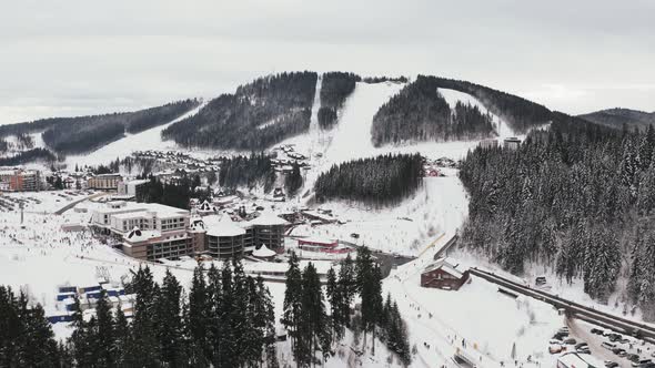 Aerial Footage of Ski Resort Village During Winter Time