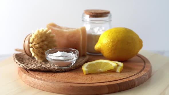 Eco Friendly Natural Cleaners Jar with Baking Soda Dish Brush Lemon Soap on White Background