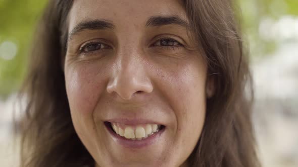 Closeup Shot of Smiling Middle Aged Woman Looking at Camera