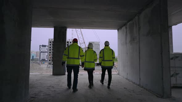 Group of Civil Engineers are Walking in Underconstruction Building Foremen and Female Architect