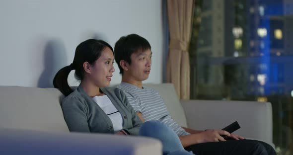 Couple Watch Tv Together at Home in The Evening