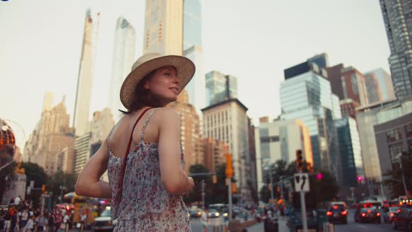 Happy girl with a retro camera in Manhattan, NYC