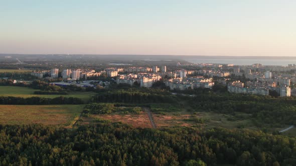 Aerial View of Solar Farm on the Green Field at Sunset Time Solar Panels in Row