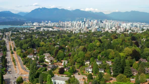 Dense Foliage And Houses In Arbutus Ridge With Vancouver Cityscape And Kitsilano Beach In Background