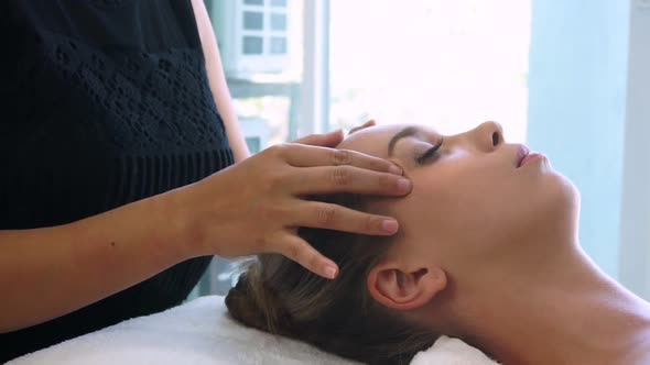 Woman Gets Facial and Head Massage in Luxury Spa