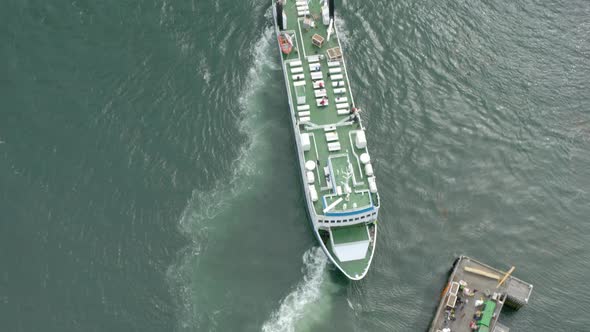 Huge Ship Sailing Across The Sea, Leaving Port At Daytime. aerial