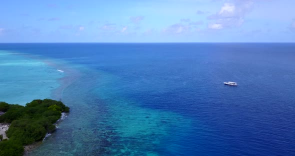 Beautiful aerial island view of a white sandy paradise beach and turquoise sea background in high re