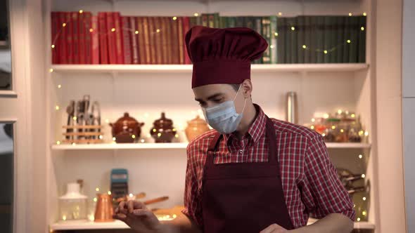 Food Blogger is Making Content Standing in Kitchen in a Face Mask and Talking About His Future Dish