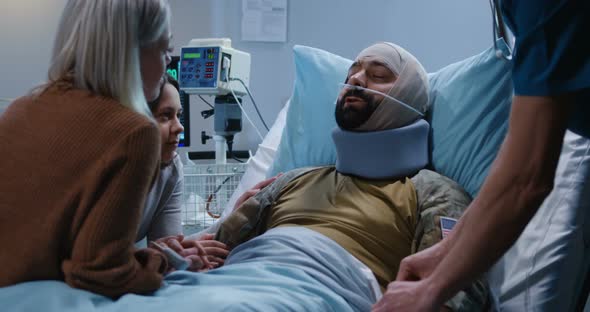 Injured Soldier Talking To Family in Hospital