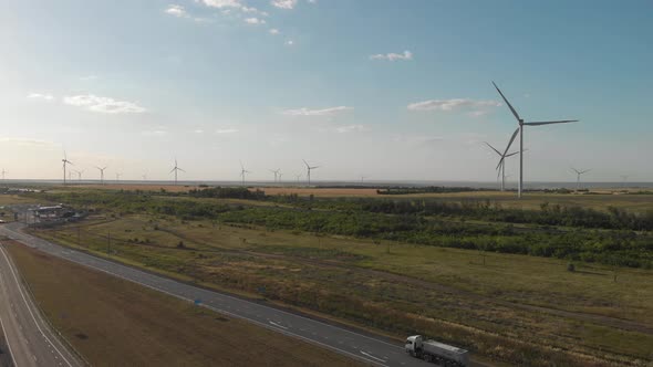 Aerial View of Wind Turbine on a Field in a Summer Day. Environment Friendly and Renewable Energy