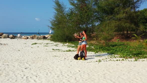 Sexy Beauty Models on Photoshoot Having Fun on The Beach on Paradise White Sand and Blue