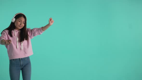 Happy Girl Dancing to Music Isolated on Background