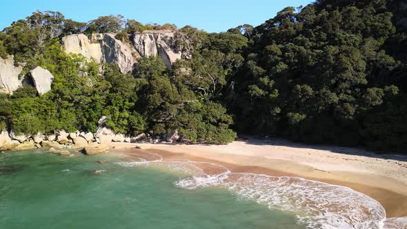 Watching waves roll in at a secluded private beach in New Zealand's Coromandel.