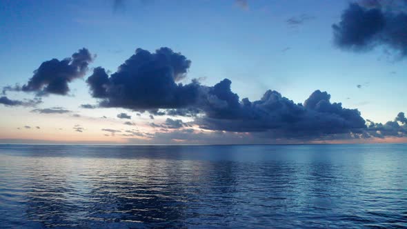 The Calm Waves Of The Ocean, With Stunning Attraction Of Clouds And Skies At Sunset In Fiji - Drone