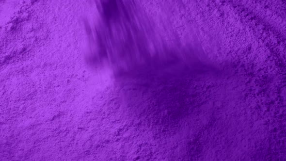 Purple Powder Pours Into Pile