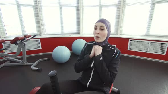 Girl Athlete in Hijab Sit Up Exercise