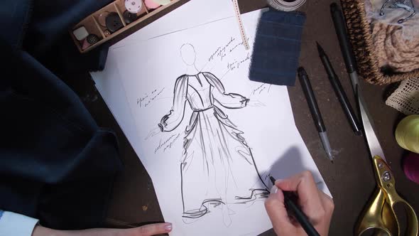 Clothes Designer Working on Fashion Sketch