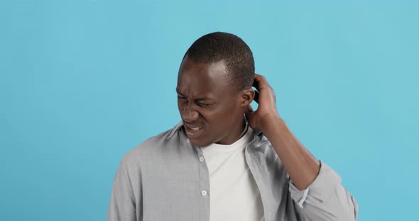 Young Black Man Suffering From Pain in Neck