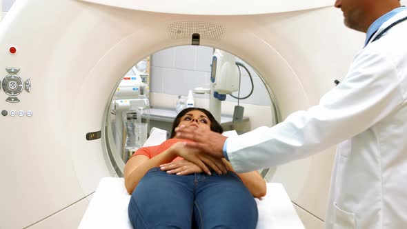 Doctor consoling a patient before mri scan