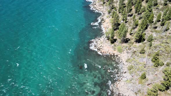 Drone Footage flying over Clear Blue water along the Shore of Lake Tahoe near Zephyr Cove Nevada