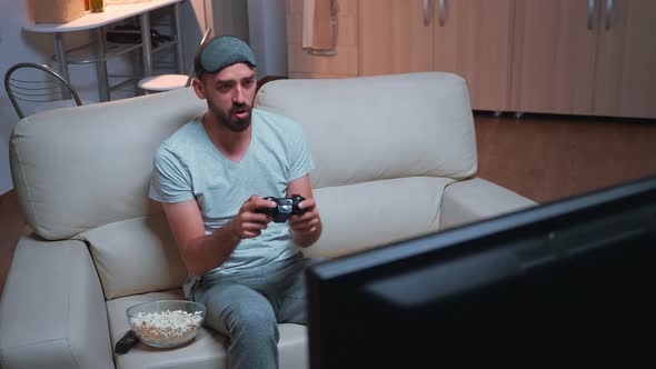 Upset Pro Gamer Losing Videogamer Competition Using Wireless Joystick