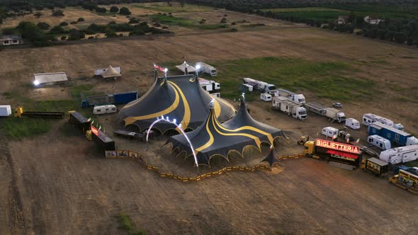 Big Top of a Circus with Caravans in a Field