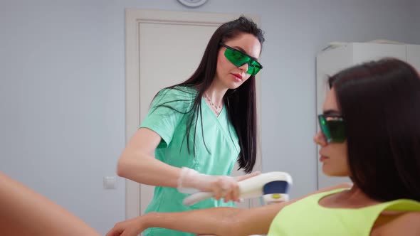 Beautician Woman Makes Procedure Laser Hair Removal Female Hands in Beauty Salon