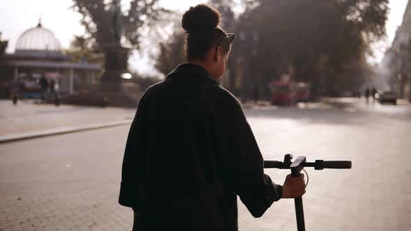 Mix Raced Woman Walking Along the City Street