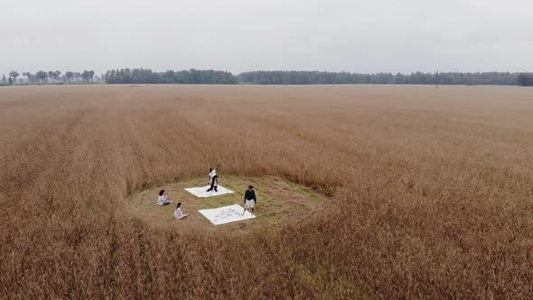 Shooting From Drone of a Group of Young People Participating in an Alternative Performance in Nature