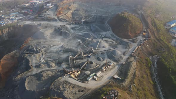 Big Crusher Working with Rubble at a Quarry Moving It on a Line