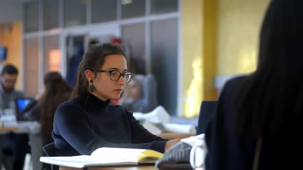 Female Working at an Open Space Coworking Office Looking Very Focused Using Her Laptop Lrrl