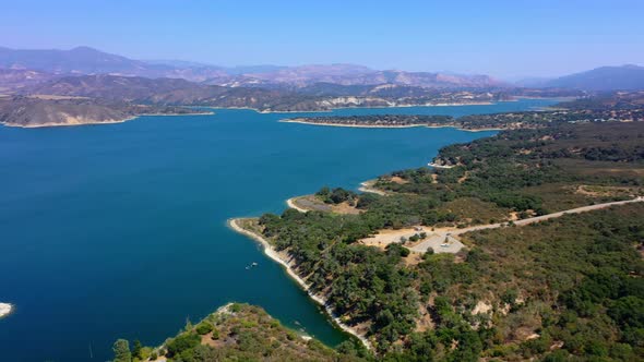 Beautiful rotating aerial shot of Lake Cachuma and the Bradbury Dam near Santa Barbara Ca.