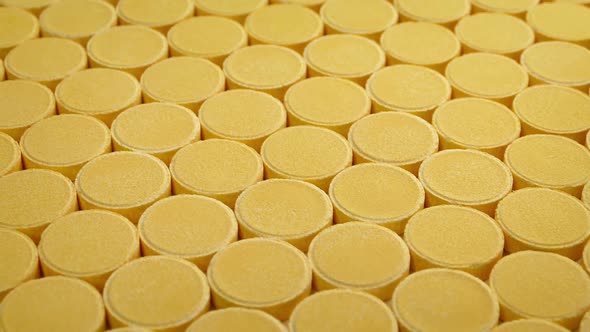 Passing Rows Of Vitamin C Tablets alt