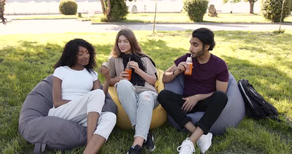 Multi Ethnic Students Having Lunch at Park