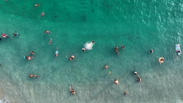 People swim in the azure sea aerial view 4 K Turkey Alanya