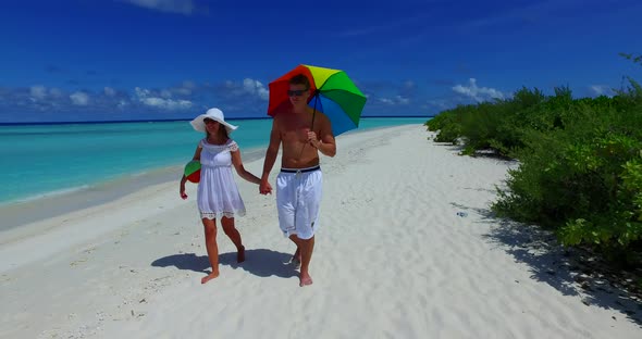 Romantic boy and girl after marriage in love enjoy life on beach on clean white sand 4K background